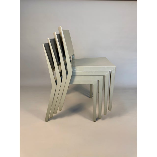 This set of four Lizz chairs was designed by Piero Lissoni for Kartell and made in Italy. The model is stamped “Lizz by...