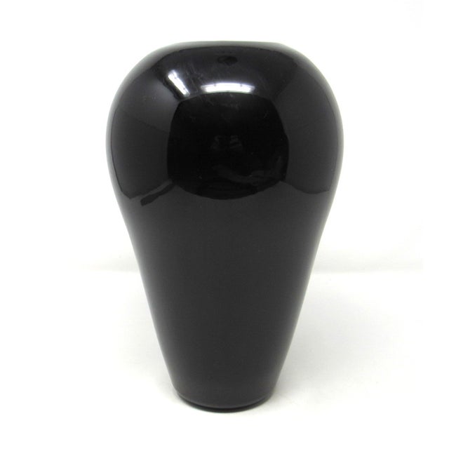 A vintage 2000 hand-blown ebony glass decorative vase by artist Steven Correia. This stunning vase has a simple and...