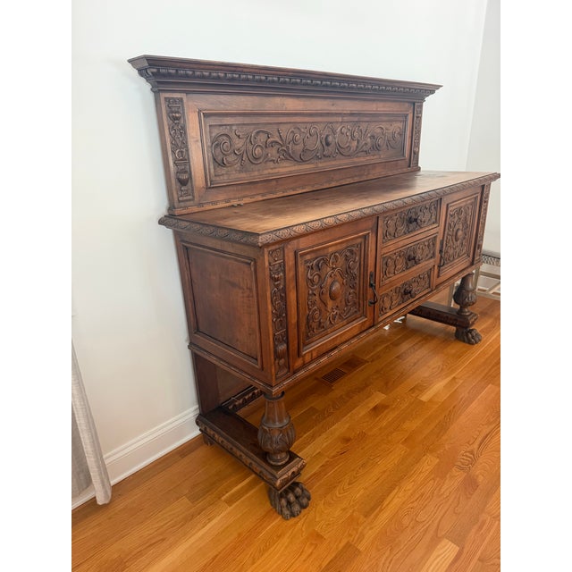 An exceptional American Renaissance Revival carved oak sideboard dating to approximately 1890–1910. This substantial...