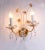 Elegant pair of wall sconces with a gold-plated brass frame and swarovski crystals. These lamps have an incomparable...