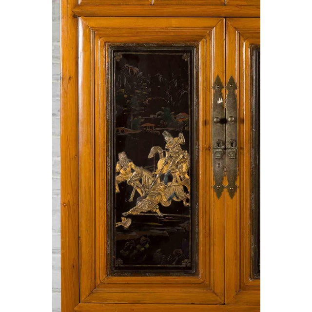 Chinese Early 20th Century Lacquered Armoire With Gilt Carved Warrior Motifs For Sale - Image 16 of 18