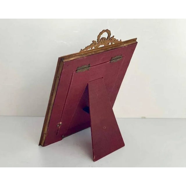 Antique frame for photos. Bronze with gilding, Mahogany. Louis XVI style. 1880s, 19th century, France. The antique bronze...