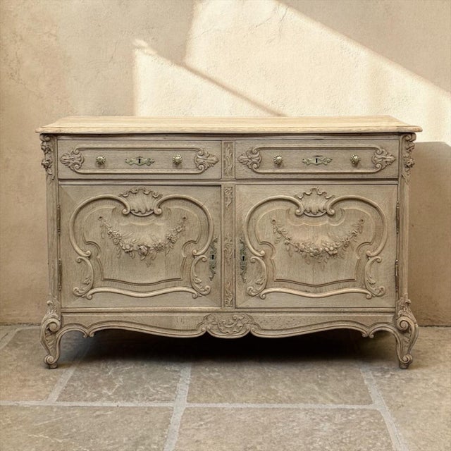 19th Century French Louis XV Low Buffet ~ Credenza in Stripped Oak was crafted by gifted cabinetmakers, and captures the...