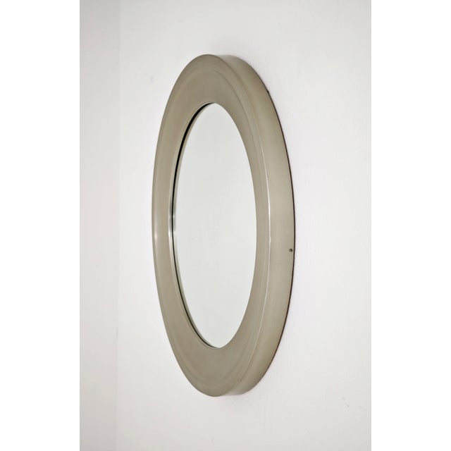 Narciso round wall mirror, designed by Sergio Mazza for Artemide in the 1960s. This piece is an icon of modernist and...