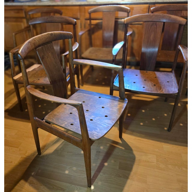 These six matching dining chairs represent exceptional examples of Swedish mid-century modern furniture craftsmanship....