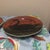 Enhance your folk art collection or rustic table setting with this charming pair of vintage decorative plates from the...