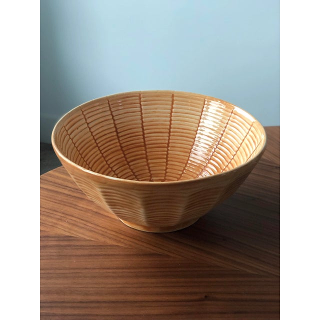 This lovely apricot, Portuguese, ceramic basket weave bowl is the perfect peachy color. It will contrast beautifully with...