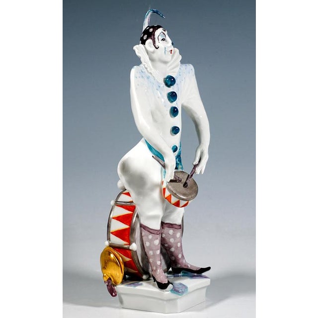 Excellent meissen porcelain figurine: clown standing with legs apart, face painted white, wearing a black and white...