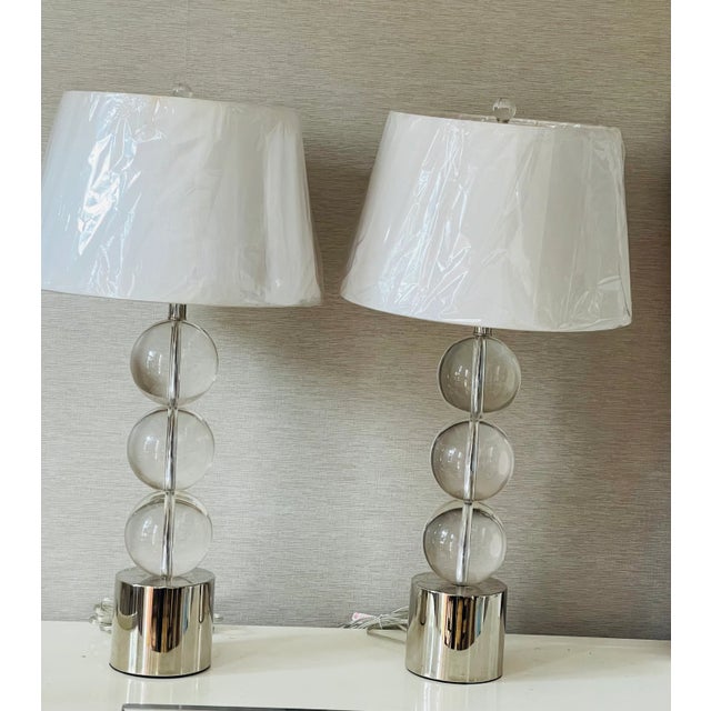 Pair of mid century lamps- heavy glass globes on chrome base.Karl Springer style.