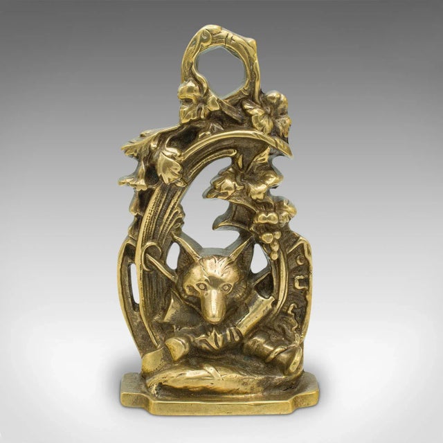 This is an antique decorative fox doorstop. An English, brass door keeper in country house taste, dating to the late...