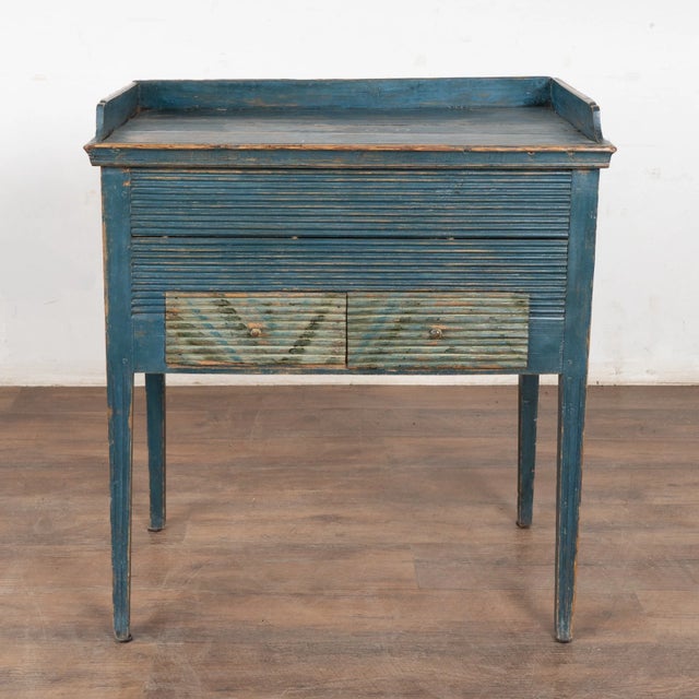 An authentic and rare mid-19th-century Swedish country side table, dated 1850. Retains its vibrant, rustic blue-painted...