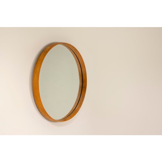 This elegant round mirror features a beautifully crafted beech frame, which adds a touch of sophistication to any room....