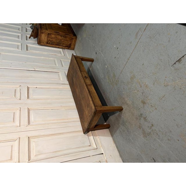 A low, rectangular 19th-century walnut coffee table featuring simple, elegant lines and a practical drawer. A versatile...