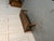 A low, rectangular 19th-century walnut coffee table featuring simple, elegant lines and a practical drawer. A versatile...