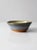 This is a vintage studio pottery bowl. Signed by the artist, Kulsea, the hand-crafted bowl features a stunning blue, tan,...