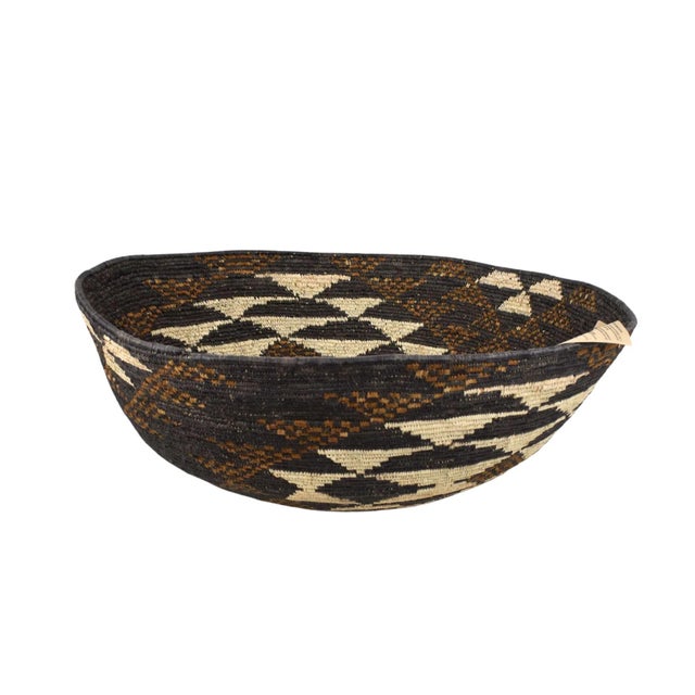 A handmade Isiquabetho basket by the Zulu People in KwaZulu-Natal, South Africa. Â Handwoven by skilled Zulu artisans...