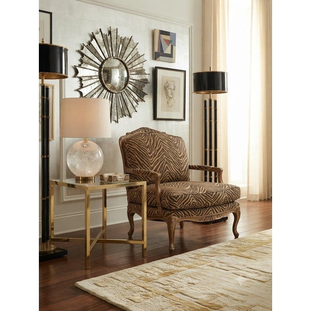 Add a touch of dramatic flair to your space with this substantial French Provincial Bergere armchair. The classic, hand-...