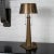 Cast bronze lighthouse table lamp with original metal shade. Features pull chain switches and base switch that controls a...