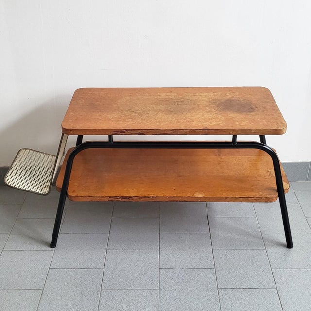In fair condition, the tabletops show numerous signs of wear, the edge veneer is in poor condition and has many missing...