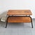 In fair condition, the tabletops show numerous signs of wear, the edge veneer is in poor condition and has many missing...