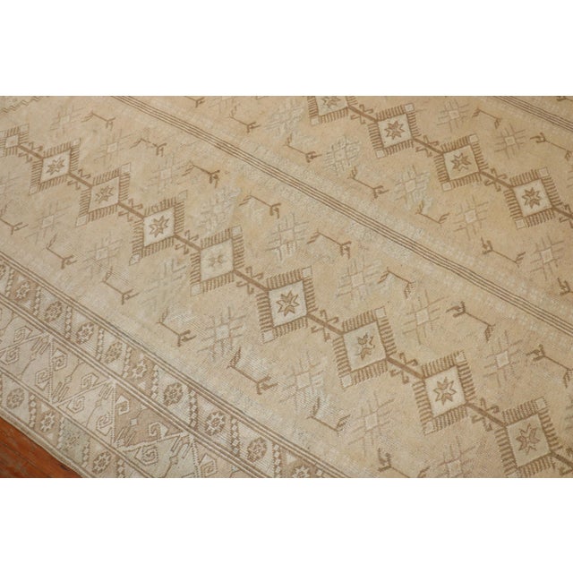 Mid-20th century neutral color room size tribal Turkish Anatolian rug Measures: 8'11'' x 12'.