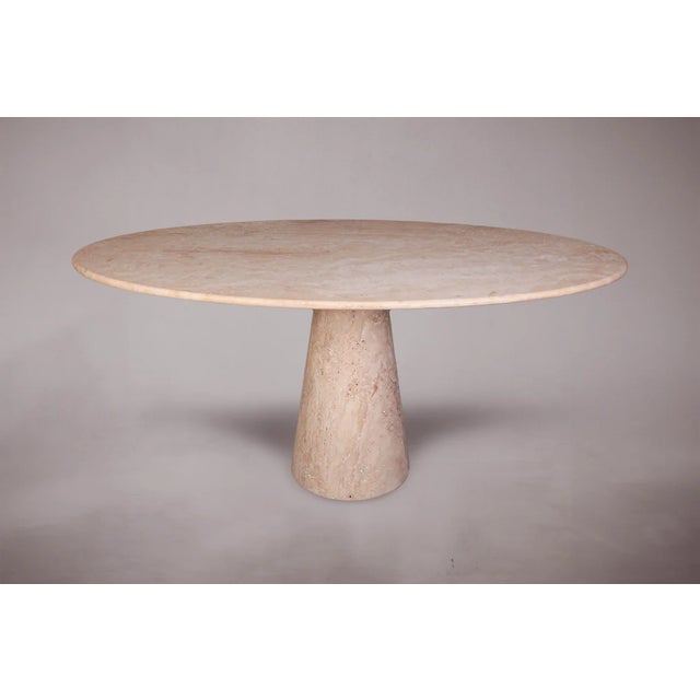 Introducing our exquisite Travertine Dining Table with a single conical leg. Crafted with precision and elegance, this...