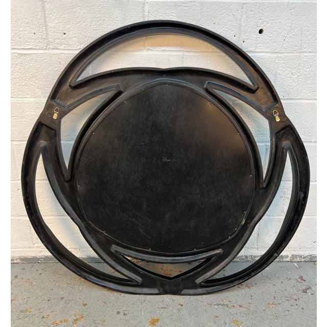 This is a Coaster Furniture transitional mirror featuring interlinking loops with a contrasting silver and high-gloss...
