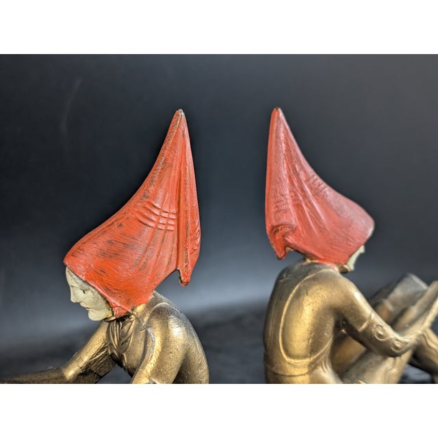 A wonderful set of original Hirsch "Pixie Girl" art deco bookends designed by Gerda Gerdago. Painted cast metal on a black...