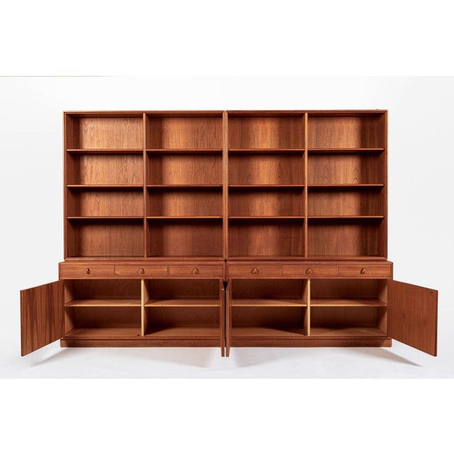 This beautiful vintage mid century Swedish modern four-piece teak wood bookcase wall unit was designed by Bertil Fridhagen...