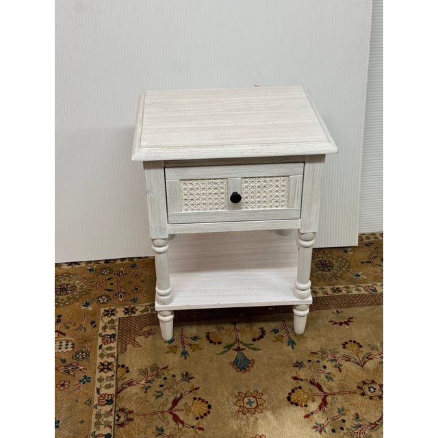 Design Plus Gallery presents the Flagstaff Nightstand. This charming bedside table combines rustic charm with practical...