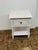 Design Plus Gallery presents the Flagstaff Nightstand. This charming bedside table combines rustic charm with practical...
