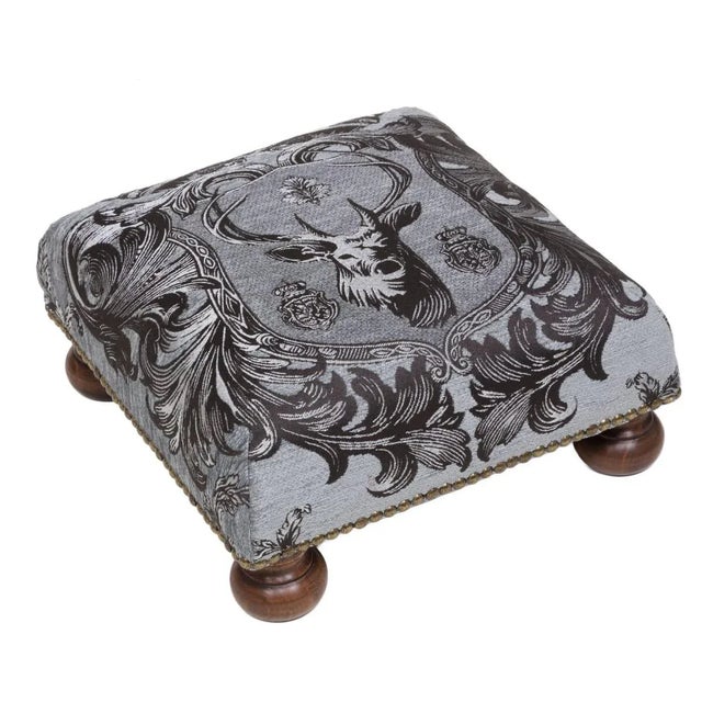 Tapestry Footstools with bun-feet and traditional-style studding.