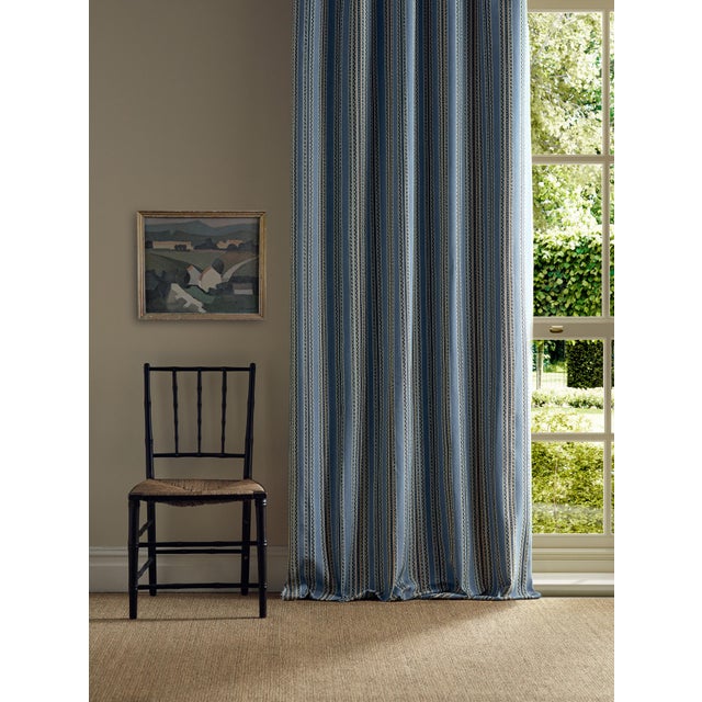 A brand-new design by the Morris & Co. team inspiration was taken from the sinuous line featured in the Scrolling Tulip...