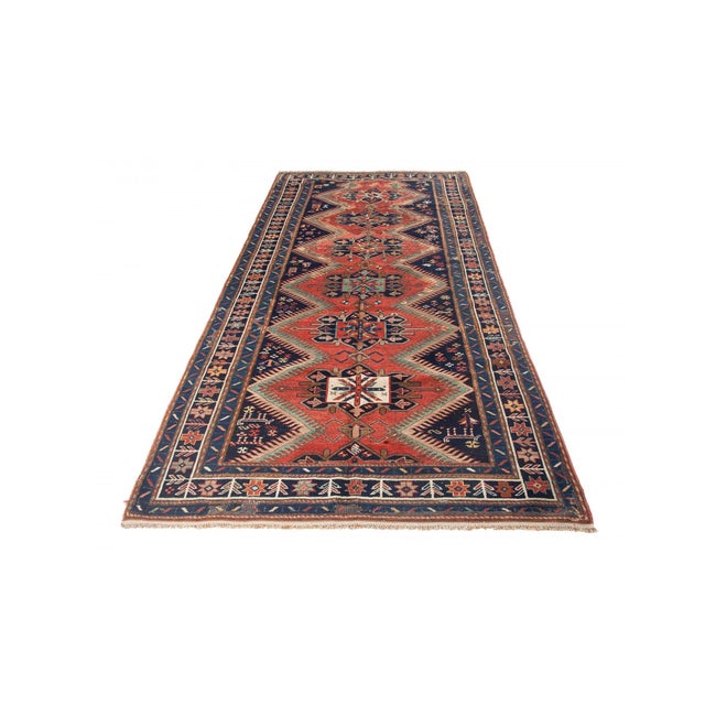 Antique decorative wool handknotted Caucasian rug. Approximately 75-85 years old. In very good condition.
