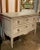 18th century Neoclassical carved and painted commode with original locks and brass lion head hardware. Circa 1775.