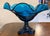 This is a handmade vintage Viking Art Glass “Epic” compote distinguished by its vibrant “Bluenique” color, showcasing its...