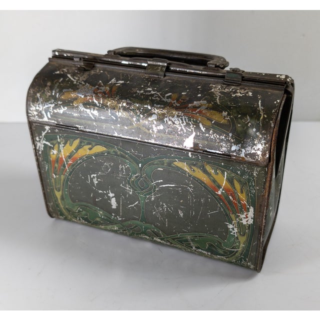 We are selling this super cool decorative Art Nouveau style tin box. This box was for Huntley & Palmer’s biscuits and has...