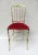 A chair ""Chiavari" from the 60s from Italy. The frame is brass, the seat is covered with red velvet. A delicate and...