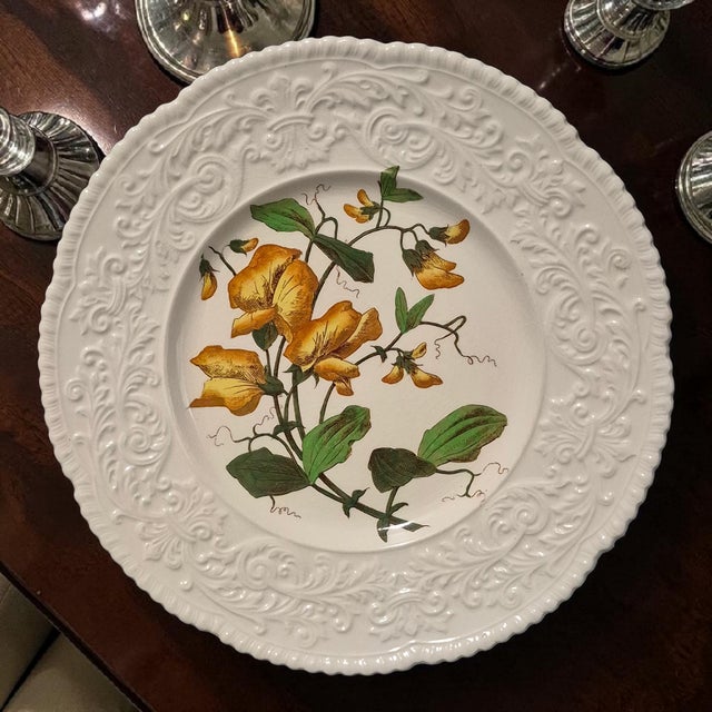 This vintage Cauldon England porcelain platter features an embossed border with a beautiful floral design, specifically...