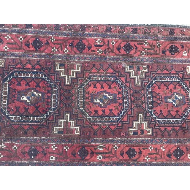 19th century collectible Baluch Turkmen rug with a beautiful geometric design and natural colors with brown, red, pink,...