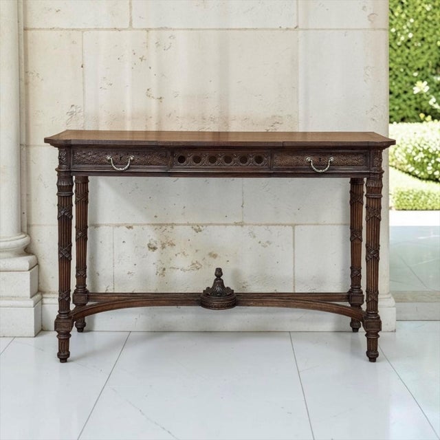 A 19th century French Louis XVI walnut console, also perfect as a sofa table, crafted in the purest spirit of the Louis...