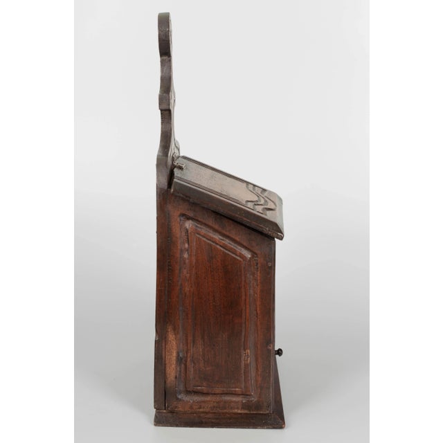 An early 20th century French boite à sel, or salt box, made of solid walnut with hinged lid and small drawer. A rustic...