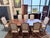 This is a beautifully crafted Ethan Allen Abbot dining table set featuring rich mahogany veneers with striking grain...