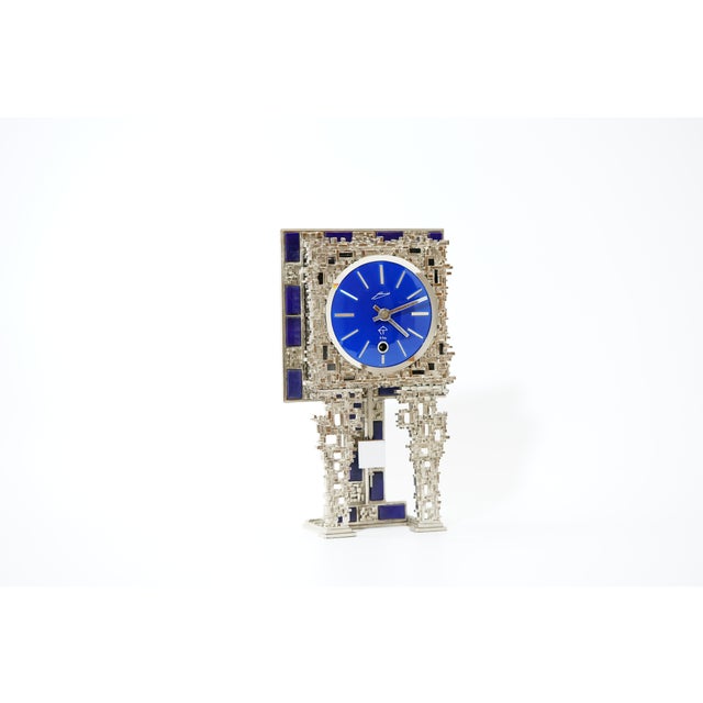 Brutalist table clock by Schmid, Germany, 1970s This expressive table clock by the German brand Schmid is a characteristic...