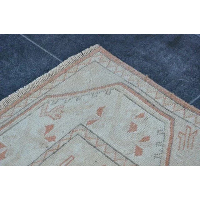 A Turkish handmade vintage Anatolian Oushak rug. We collect old vintage antique rugs from Anatolia, which is the eastern...