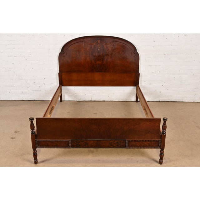 A gorgeous French Regency Louis XVI style carved burled walnut full size bed frame In the manner of Berkey & Gay USA,...
