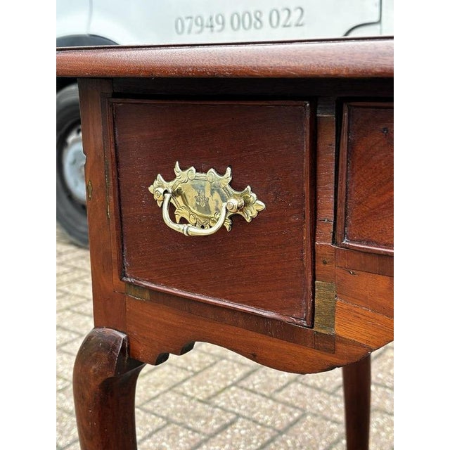 Georgian Lowboy with Brass Handles 74.5 cms high 55 cms depth 81 cms wide. Has the odd knock and signs of wear but a very...