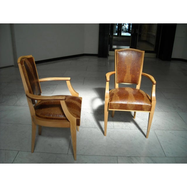 These armchairs are made out of cowhide with crocodile embossing.