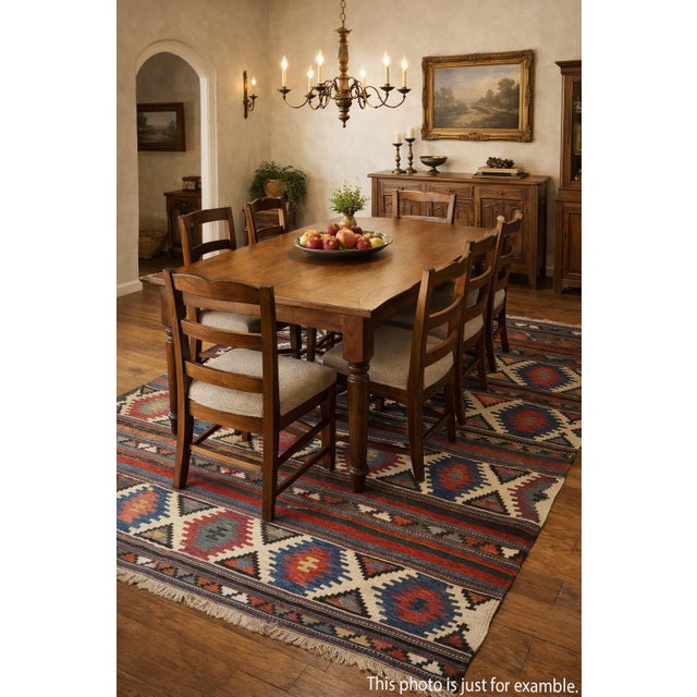 This handwoven Shirvan kilim embodies the artistry of the Caucasus, with its striking geometric motifs and vibrant natural...