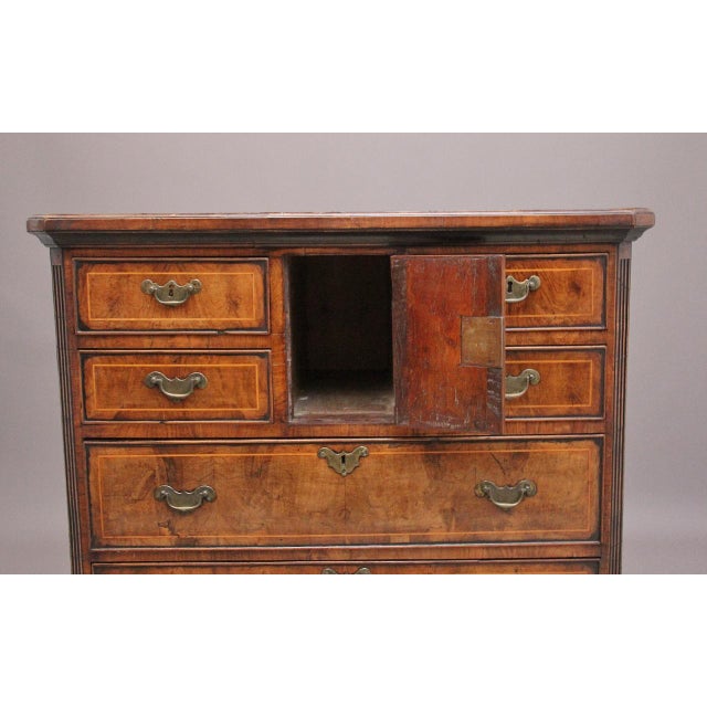 Early 18th Century George II walnut Norfolk chest of drawers, having a wonderful crossbanded and figured top above a...